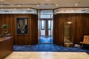 Acoustic panel solutions for luxury offices in the GCC featuring wood wall systems in a premium Dubai workspace