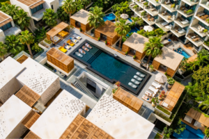 Ventilated façade system with PARKLEX natural wood veneer cladding on a luxury Dubai hotel exterior — OBRAS International