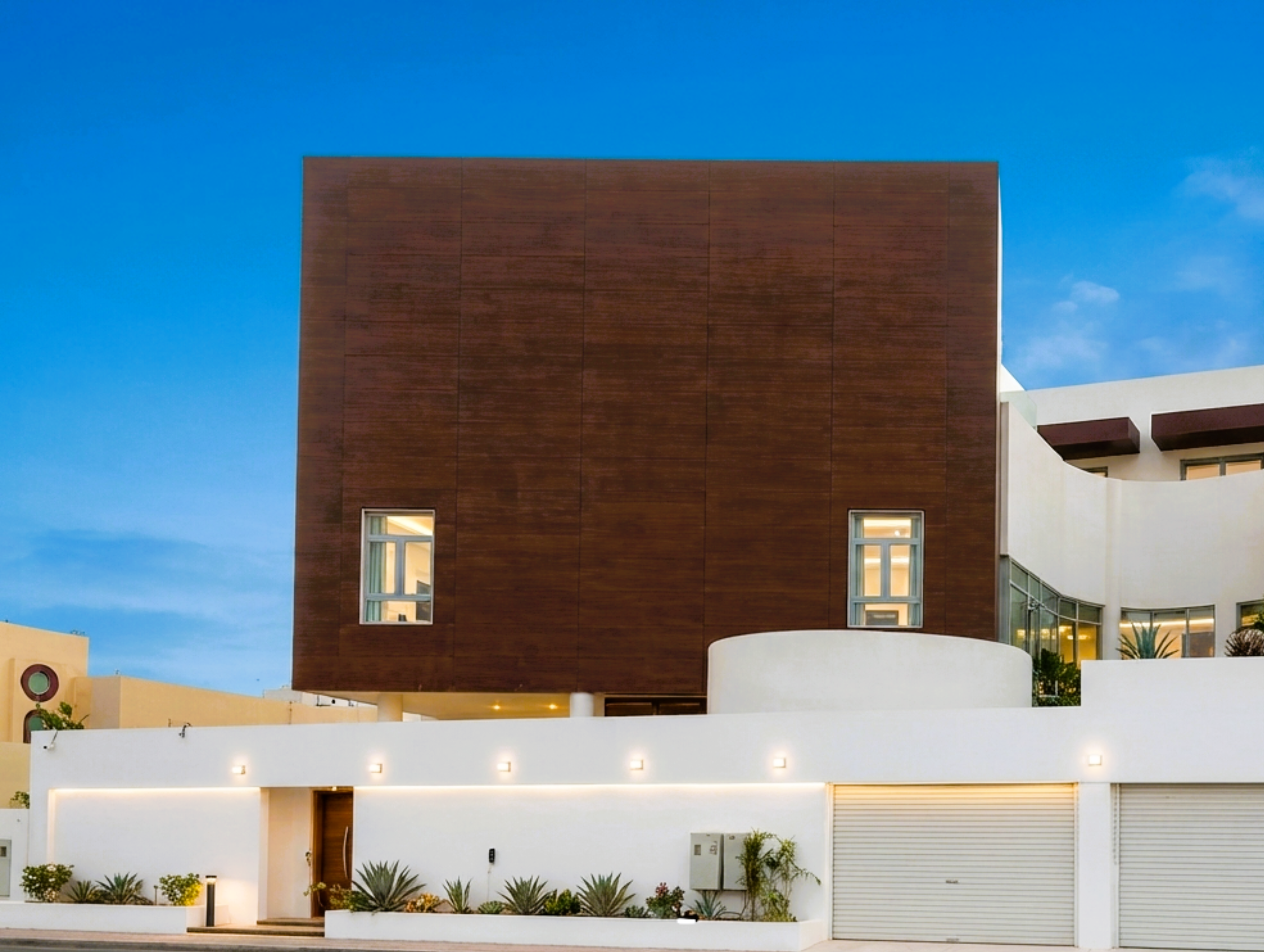 Natural wood veneer façade and soffit concept for a Saudi hospitality entrance with coordinated joints