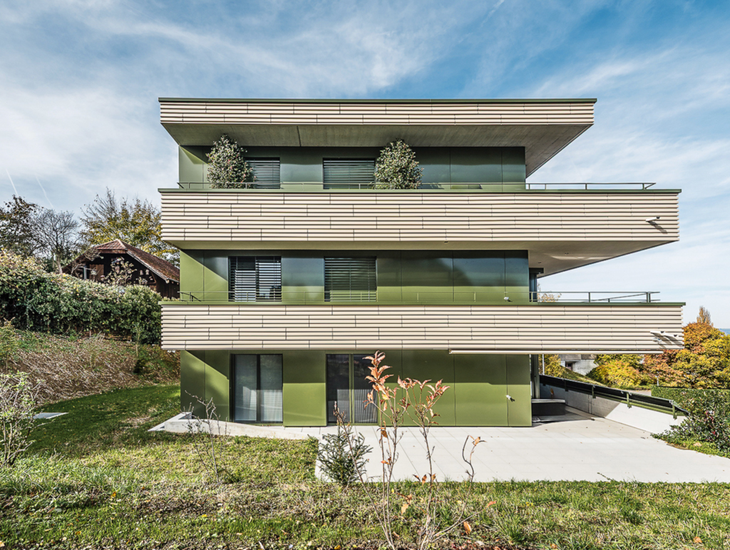 Profiled terracotta cladding creating texture and shadow on a commercial façade