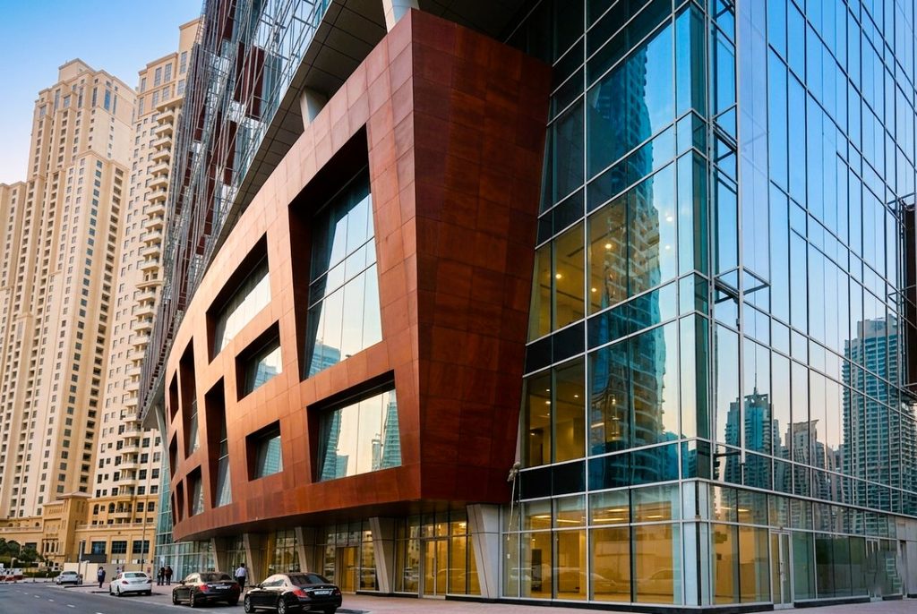 Technical detail of a ventilated façade system showing exterior cladding panels, supporting substructure and ventilation cavity for architectural projects in the UAE.